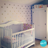 Gold polka dot wall decals for nurseries.